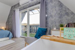 a bedroom with a bed and a large window at Panorámaház Bükkszék in Bükkszék +51 photos