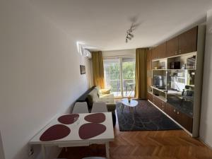a living room with a couch and a table at Micho Apartment in Ohrid