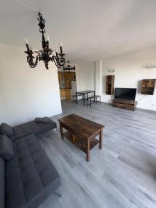 a living room with a couch and a table at Apartamento VistaSol in Rincón de la Victoria