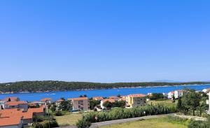 a view of a city and a river at Apartments Opsenica Barbat in Barbat na Rabu