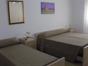 Postel nebo postele na pokoji v ubytování Don Nicola Residence