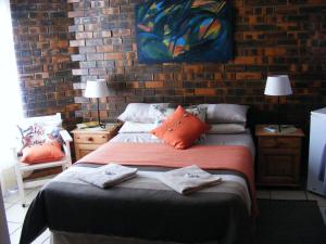 Ένα ή περισσότερα κρεβάτια σε δωμάτιο στο The Highland Inn