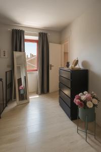 a dressing room with a dresser and a mirror at Grotte Relax in Grotte Santo Stefano
