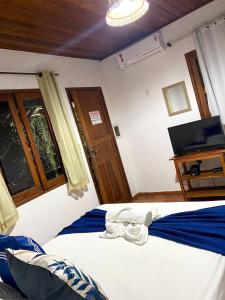 Cama o camas de una habitación en Pousada Arraial Lua Crescente