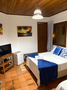 Cama o camas de una habitación en Pousada Arraial Lua Crescente