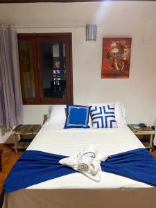 Cama o camas de una habitación en Pousada Arraial Lua Crescente