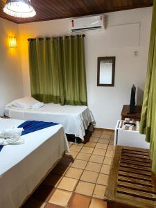 Cama o camas de una habitación en Pousada Arraial Lua Crescente