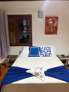 Cama o camas de una habitación en Pousada Arraial Lua Crescente