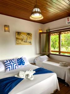 Cama o camas de una habitación en Pousada Arraial Lua Crescente