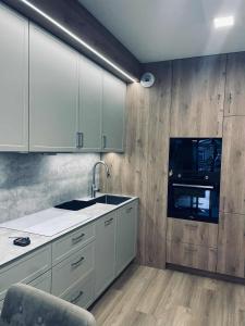 Η κουζίνα ή μικρή κουζίνα στο Apartament NATALKA SPA ul Traugutta