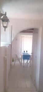 a dining room with a table and a blue table at La Maisonnette in Rio Marina