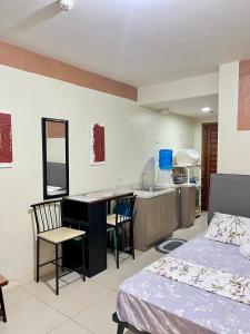 Kuchyň nebo kuchyňský kout v ubytování Magsayo Cozy Room