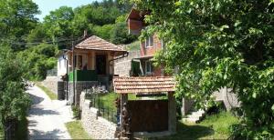 a house with a gate in front of it at Vila Stara in Pakleštica