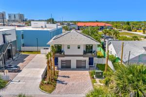 an aerial view of a house in a city at Wave Haven Villas - 2 Luxury Villas - 3BR 3 and a Half BA Each - Sleeps 8 Per Unit - Hot Tub - Across from Beach - Rocket and Beach Views in Cocoa Beach