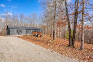 a house in the woods with a road leading to it at Buckingham Woods I Hocking Hills in Logan