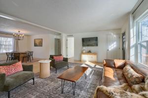 a living room with a couch and a table at Buckingham Woods I Hocking Hills in Logan +35 photos