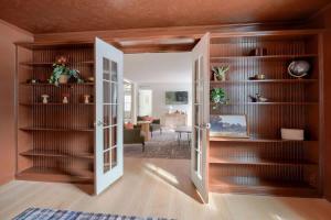 a room with a door open to a living room at Buckingham Woods I Hocking Hills in Logan