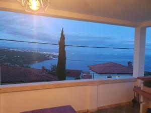 a large window with a view of the water at Apartments Opatija Sea View in Opatija
