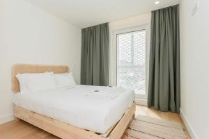 Postel nebo postele na pokoji v ubytování Liiiving in Matosinhos - Factory Pearl Apartment