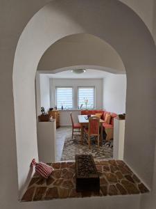 a living room with a table and a dining room at Ferienwohnung Steiger-Kaue am Rammelsberg in Goslar