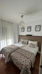 a bedroom with a large bed with a blanket on it at Luxury Sunny Villa in Málaga +25 photos