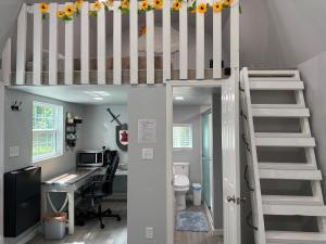 a room with a desk and a loft bed at Tiny house with smart bidet and water purify-system in Gastonia