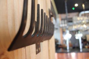 a close up of a wooden wall with a bunch of knives at The Tilman in Barmouth