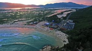 an aerial view of a beach with a crowd of people at Cris Hotel in Florianópolis