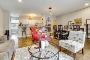 a living room with a couch and a dining room at Walk to Bites and Whittier Park Uptown Getaway! in Minneapolis