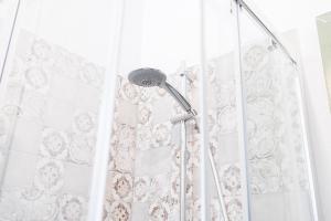 a shower with a shower head in a bathroom at Tenuta Dafne in Vinchiaturo +53 photos