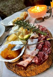 a plate of food sitting on top of a table at Azienda Agricola Veldidonna in Aggius