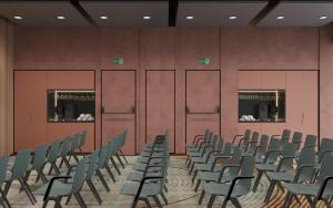 a row of chairs in a room with red walls at Hyatt Place Tallinn in Tallinn