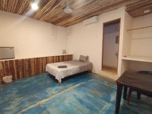 En eller flere senge i et værelse på Hotel Casa Maguey