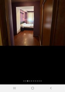 a view of a room with a bedroom and a bed at Квартира in Aghk'ilisa