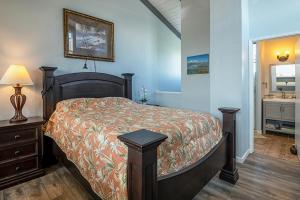 a bedroom with a bed and a sink in it at Kailua Bay Resort#2-306 in Kailua-Kona +14 photos