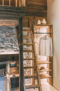 Μία ή περισσότερες κουκέτες σε δωμάτιο στο Chalet Hideaway Alpi