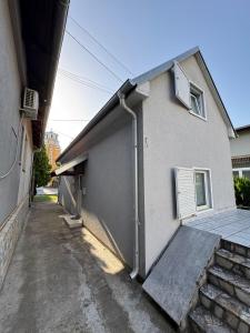 a house with a drainpipe on the side of it at Villa Vera in Vrnjačka Banja