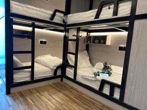 a couple of bunk beds in a room at Affordable Luxury Capsule Bed in Downtown Dubai Near Metro in Dubai +38 photos