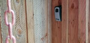 a door with a phone sticking out of it at La Palombière in Saint-Symphorien