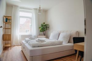 Postel nebo postele na pokoji v ubytování Altstadt-Apartment mit Parkplatz & Frühstück - ruhig & zentral gelegen