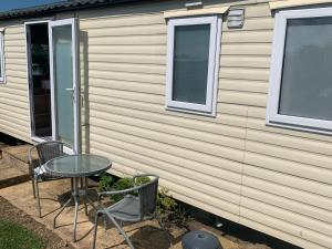 a table and chairs in front of a house at Trenance in Newquay
