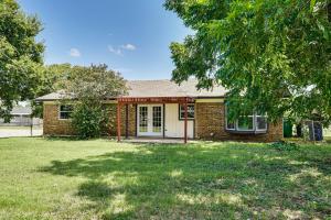 a brick house with a tree in front of it at Family Home in Ft Worth Suburbs Near Benbrook Lake in Crowley