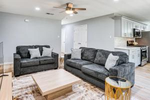 a living room with a couch and a table at Family Home in Ft Worth Suburbs Near Benbrook Lake in Crowley