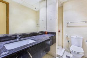 a bathroom with a sink and a toilet at Live in the center of Mountains, Sea, Mangroves in Ras al Khaimah +15 photos
