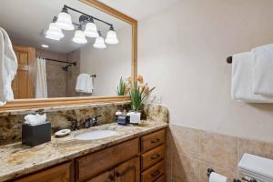 a bathroom with a sink and a mirror at Lodge Tower 281 in Vail