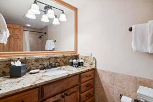 a bathroom with a sink and a mirror at Lodge Tower 283 in Vail