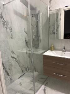 a bathroom with a shower and a sink at Miramare in Crotone +36 photos