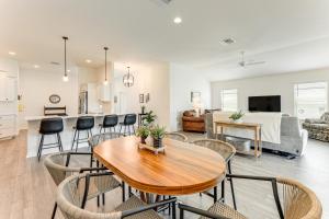 a kitchen and living room with a table and chairs at New Designer Home in The Villages Shady Brook in Wildwood