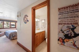 a bathroom with a movie poster on the wall at Lodge Tower 290 in Vail