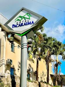a sign for a restaurant in front of a building at Hotel Pacaraima in Mecalineta